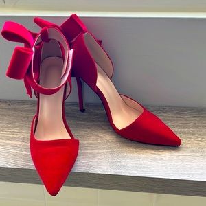 Red velvet pumps with ankle bow